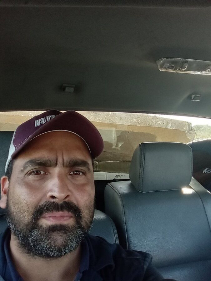 Esteban "Lalo" Rodriguez, owner of RDZ Roadside, in a truck cab in Pharr, Texas