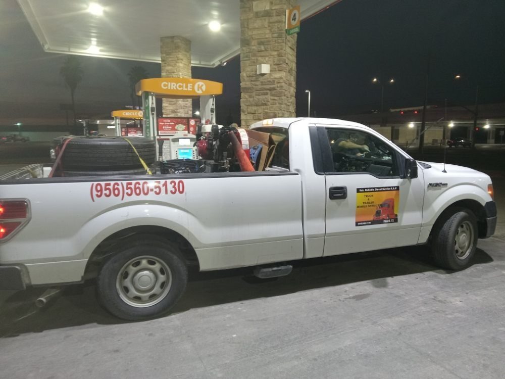 RDZ Roadside mobile service truck with tire and air compressor, phone number on the bed side
