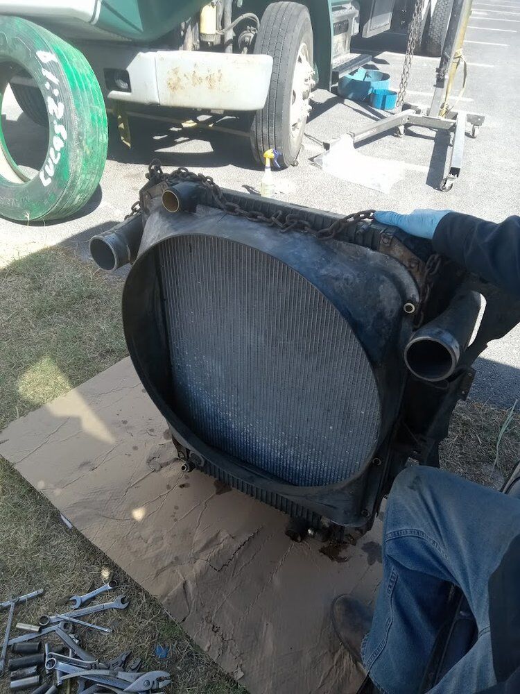 Charge air cooler removed and laid out during a cooling system repair